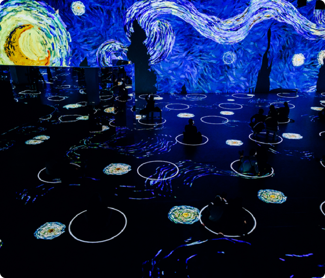 Swirling night sky projected across walls and floor